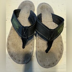 Flip flops with black leather strap. Tire bottoms.burlap cushion sole
